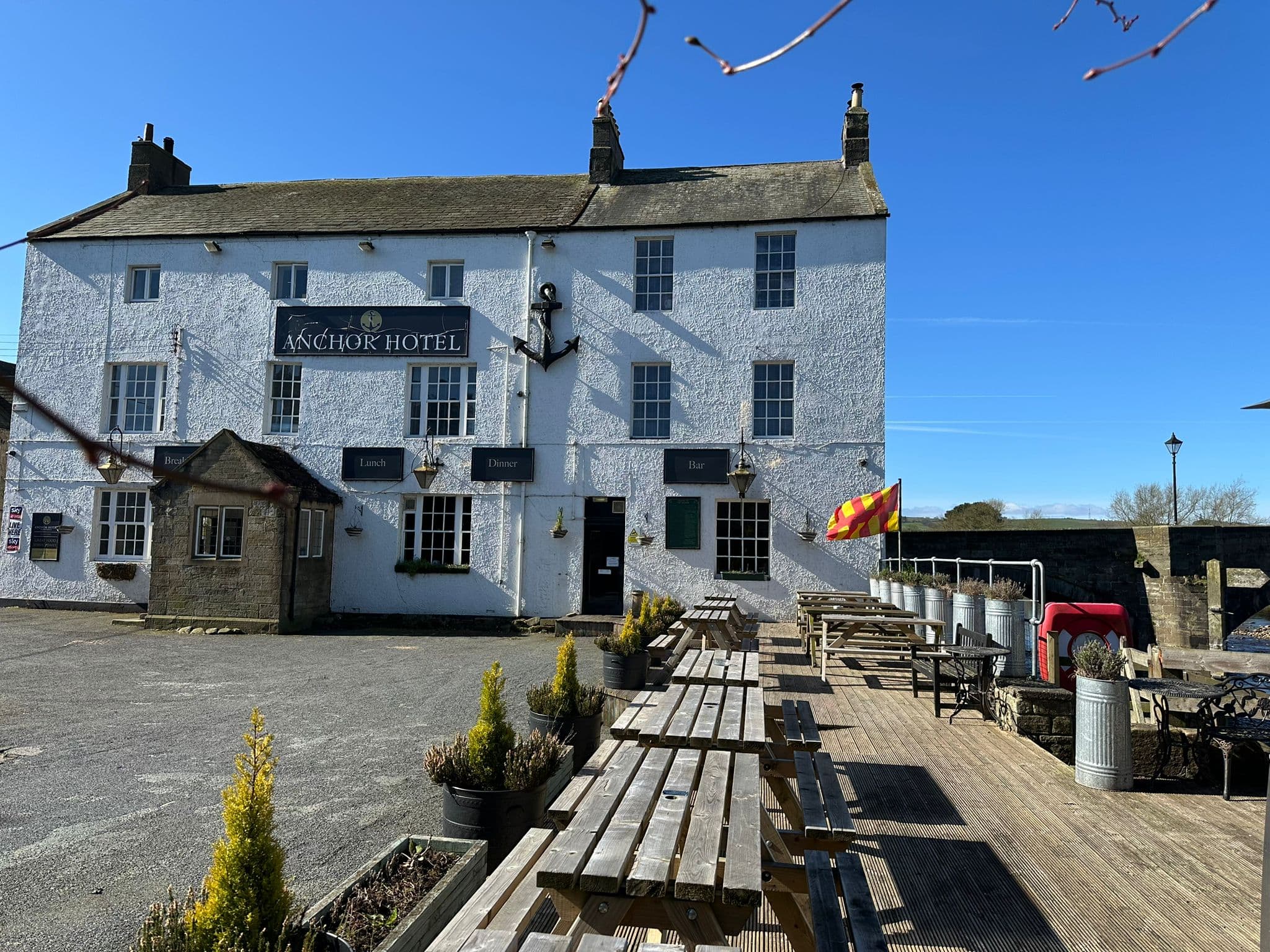 Riverside terrace seating outside The Anchor Hotel Haydon Bridge