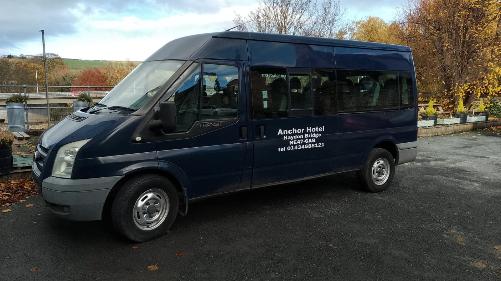 The Anchor Hotel 15-seat shuttle minibus parked by the terrace